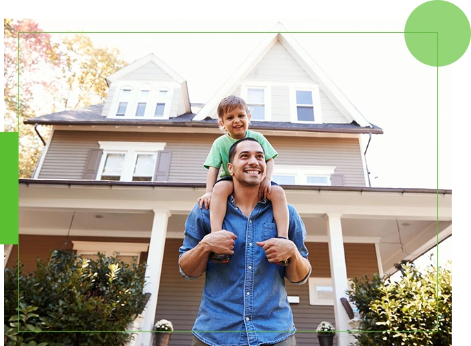 A man and his son are standing in front of their home.